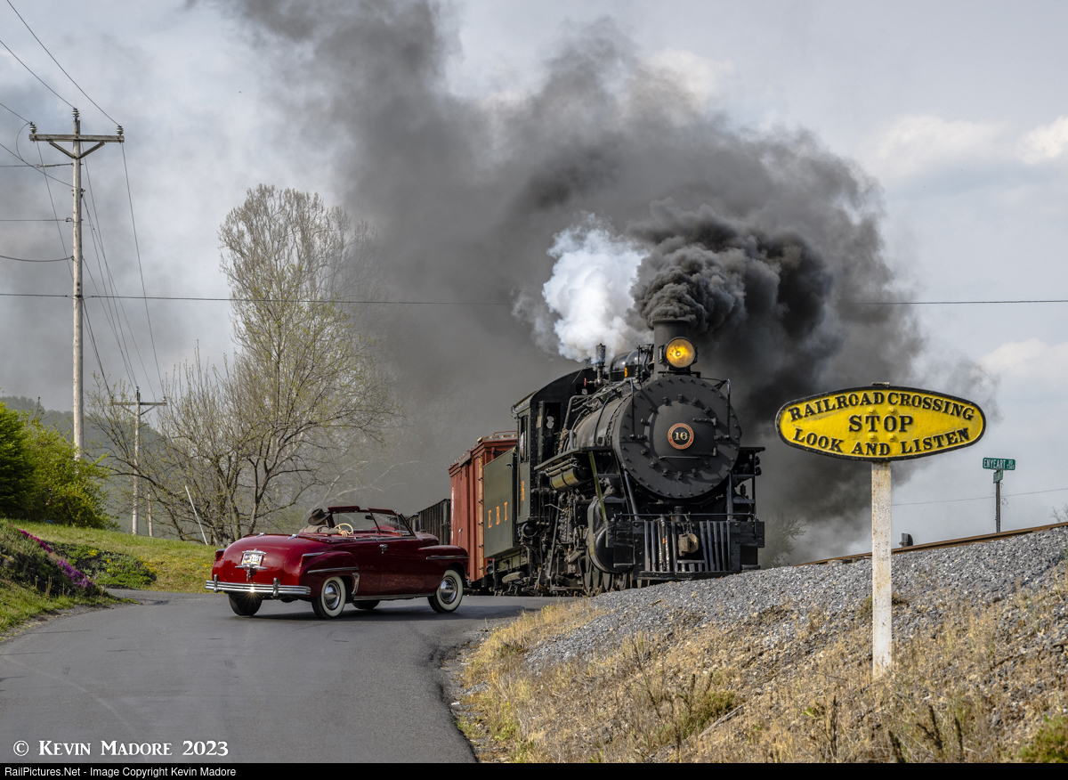 A motorist watches as a southbound East Broad Top freight barrels through the unguarded crossing at Enyeart Road, headed for the yards at Rockhill Furnace, just less than a mile ahead.This image was captured during an April, 2023 photo shoot at the East - IGE Erlebnisreisen | Kevin D. Madore