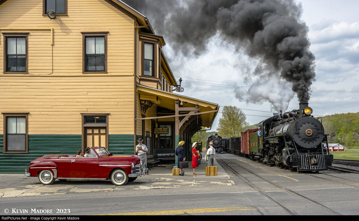 In the tiny borough of Rockhill Furnace, PA, theres not much to do on a lazy afternoon except wander down to the East Broad Top depot and watch trains.  Here, a young couple out for a drive in their sporty Plymouth DeLuxe pause to watch the arrival of a  - IGE Erlebnisreisen | Kevin D. Madore